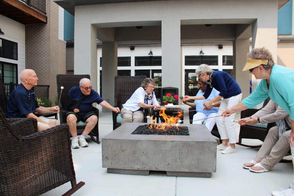Residents gathered around an outdoor fire pit